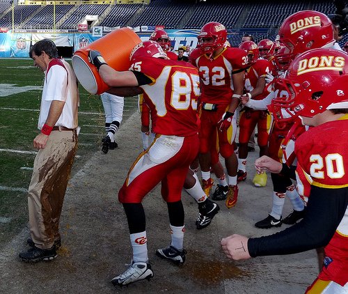 Cathedral Catholic head coach Sean Doyle gets the Gatorade treatment from Dons tight end Blake Wolfe