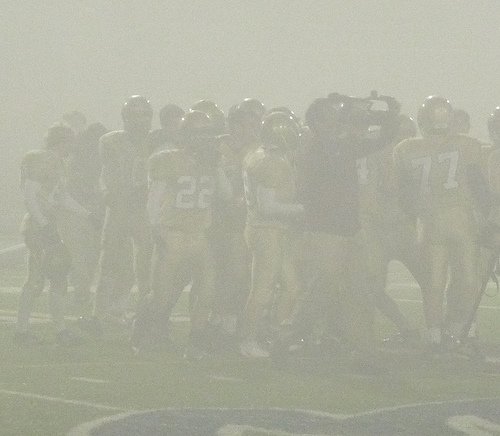 Bishop’s players celebrate their Division V title in a heavy fog
