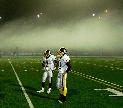 Francis Parker running back Kenny Brookins (7) and receiver Justin Rasmussen wait for the play call with the fog creeping in