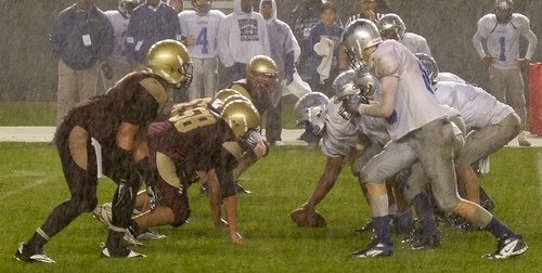 Rain falls on the Bishop’s offense before the snap