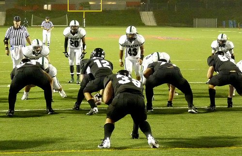 Oceanside defenders size up the Servite offense before the snap