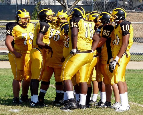 Mission Bay quarterback Nate Long calls out a play in the offensive huddle