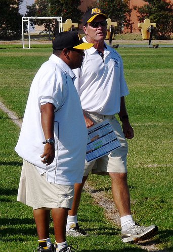 Mission Bay head coach Willie Matson and the Bucs defensive coordinator on the sideline
de