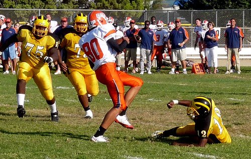 Valhalla receiver No. 80 hauls in a pass between three Mission Bay defenders