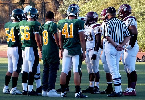 Captains from Patrick Henry and Point Loma meet for the coin toss