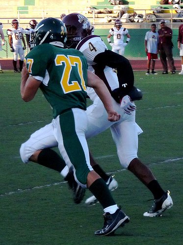 Patrick Henry defensive back Maxamillian Loree and Point Loma defensive back Aaron Watkins match strides on a punt