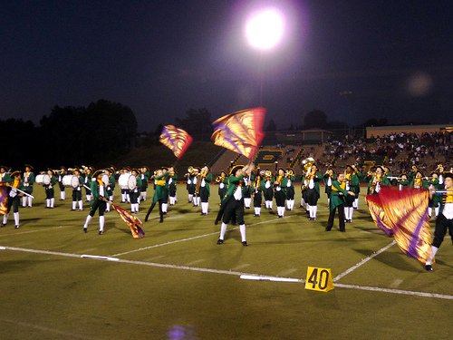 The Patrick Henry High School Marching Patriots and color guard bust a move during their halftime performance