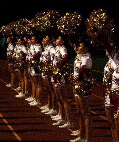 Torrey Pines cheerleaders cheer on the Falcons