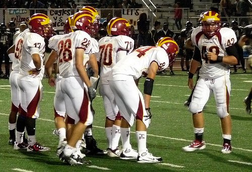 Torrey Pines linebacker Kevin Cuff looks to the sideline for the defensive play call