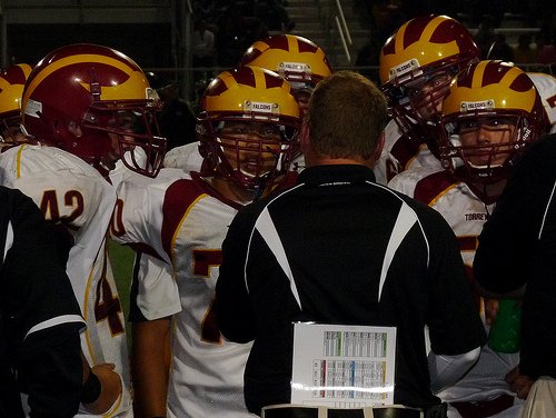 Members of Torrey Pines’ defense listen intently during a timeout