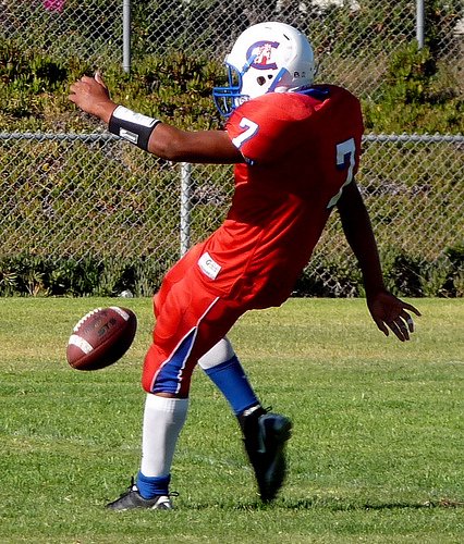 Crawford punter Jorge Perez gives the ball a boot