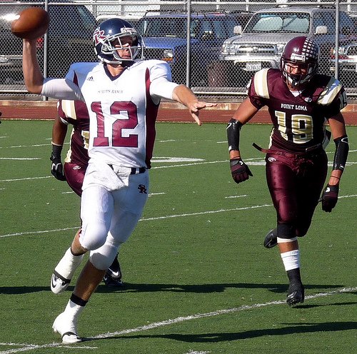 Scripps Ranch quarterback Jake Fish lets a pass fly with Point Loma defensive end Johnny Castaneda chasing