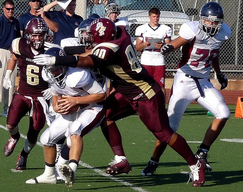 Point Loma defensive lineman Christian Heyward swarms Scripps Ranch quarterback Jake Fish for a sack
