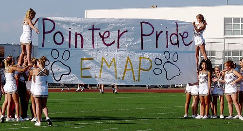 The Point Loma banner features the team’s motto E.M.A.P – “Every Man A Pointer”