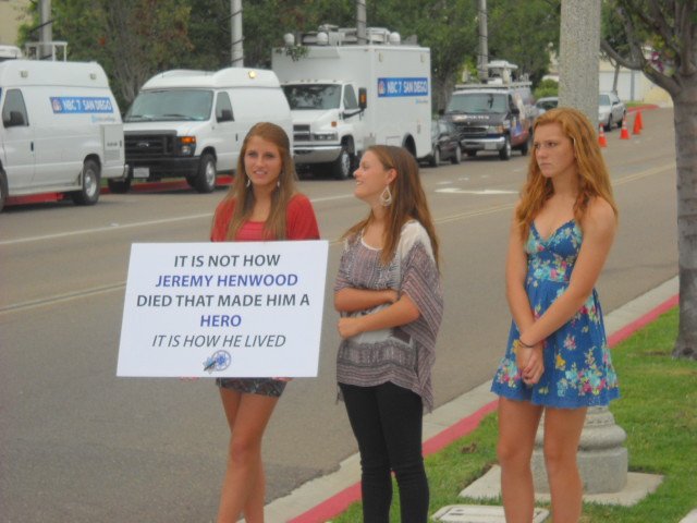 Young ladies at Rock Church service for fallen police officers.