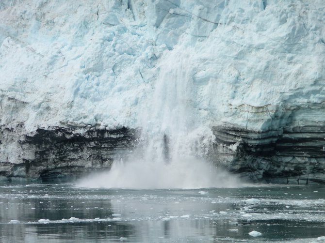 The ice calving of the active Margerie Glacier in Glacier Bay of southeast Alaska, June 2011, accompanied by the cracking thunder-like roaring sound in the midst of wilderness of tranquility.
