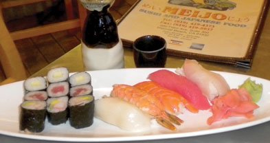 The sushi mix: five kinds of fish flesh on rice, plus nine pieces of sushi rolls