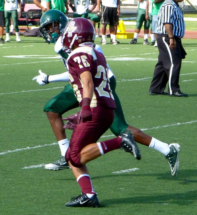 Point Loma running back Johnny Maes covered by a Lincoln defender on a Pointers punt
