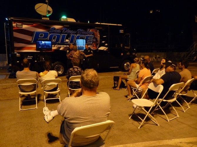 This was at the Broadway Pier during the blackout. People watched the big football game on the police truck. September 8, 2011