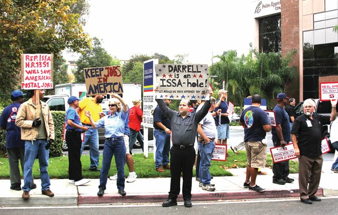 Assembly outside Congressman Darrell Issa’s Vista office called for a tax on Wall Street.