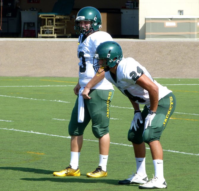 Palo Verde Valley quarterback Ryan Galvan (13) and running back Jesus Espinoza (24)