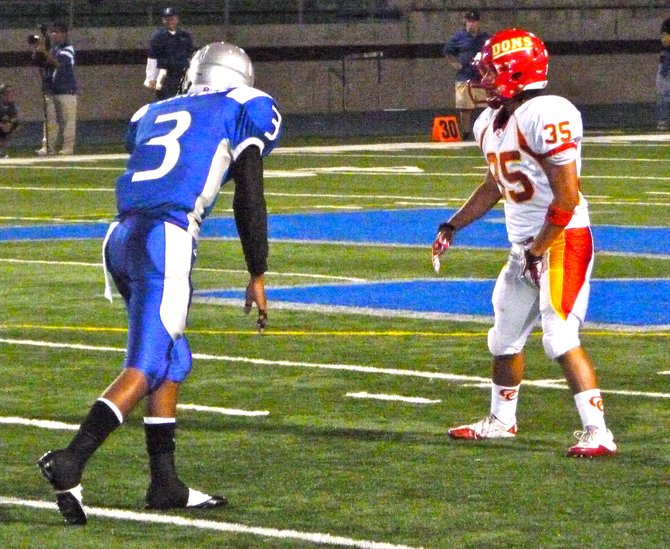 Eastlake receiver Ronnie Cortell lines up across from Cathedral Catholic defensive back Bryce Hageman on a Titans punt