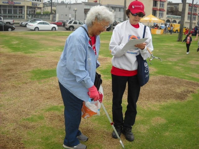 Lovely lady volunteers in OB for Coastal Clean-up Day.