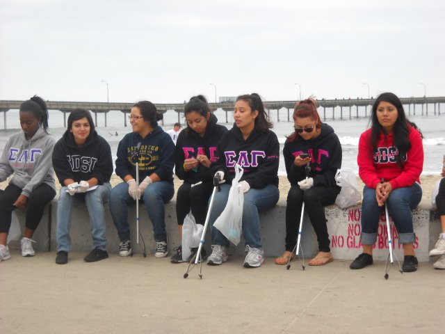 SDSU frat ladies volunteer to pick up trash in OB for Coastal Cleanup Day.