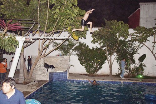 High-dive board over a near-Olympic-size pool