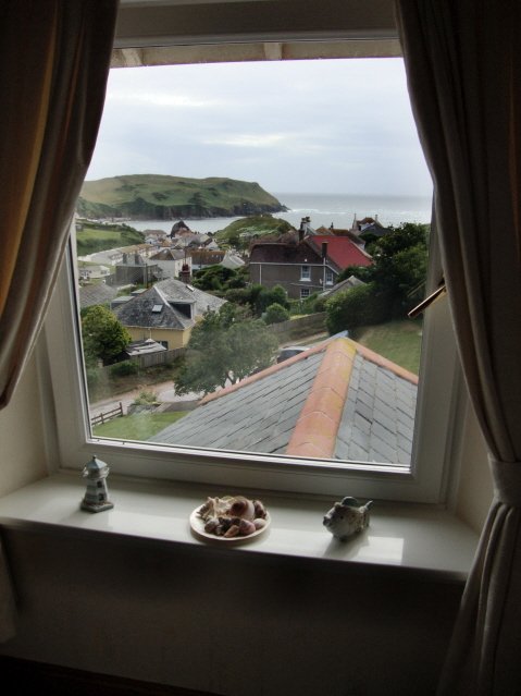 Beautiful view of the seaside village from a guest house in Hope Cove, England.
