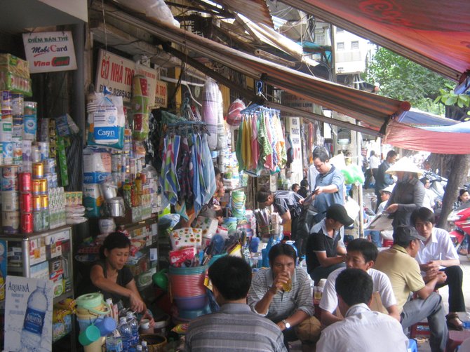 A crowded sidewalk in Hanoi.