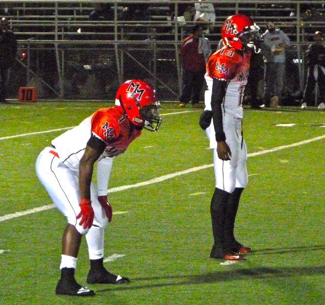 Mount Miguel quarterback Ernest Williams (right) and running back Derrick Dunn in the backfield