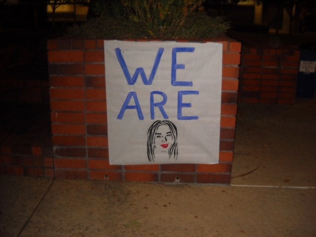 Sign honoring Diana Gonzalez at candlelight vigil.