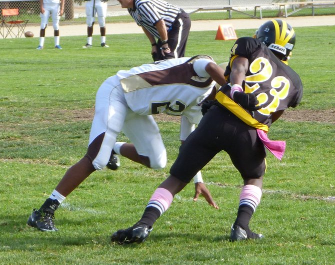 Mission Bay defensive back Airric Parker blocked by Serra receiver Stephon Zackiewicz on a Buccaneers punt