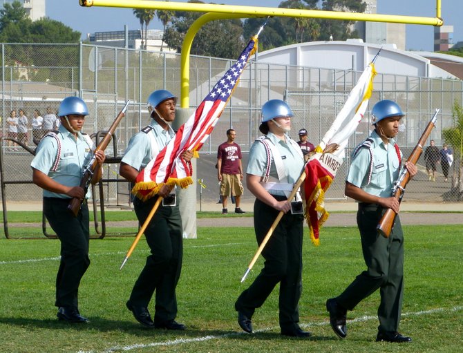 Members of Kearny High's Army Junior ROTC present the colors before the San Diego-Kearny game