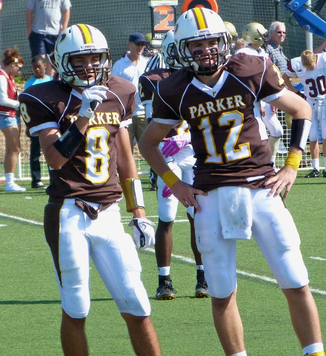 Francis Parker receiver Hank Childs (8) and quarterback Gabe Harrington look to the Lancers' sideline for the play call