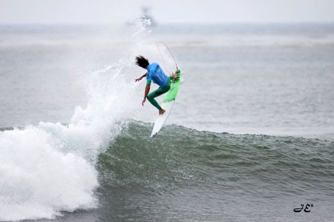 Australian Pro Surfer Owen Wilson twisting into a perfect aerial 360 at the Hurley Pro. Held at Trestles Reef in North San Diego County