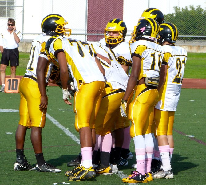Mission Bay quarterback Nate Long in the offensive huddle