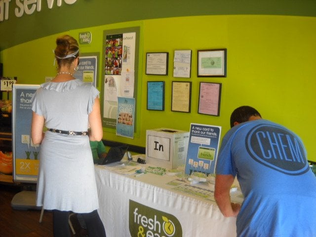 Signing up for the new Fresh & Easy rewards card in Point Loma.