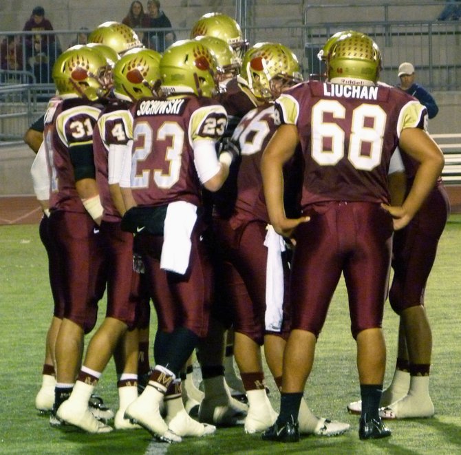 Mission Hills in the offensive huddle