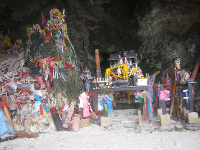 This temple is in Phra Nang Cave on Railay Beach in Thailand. The spirit of a princess goddess supposedly resides here.