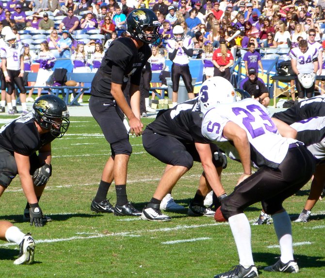 Valley Center quarterback Ryan Kleiman surveys the Santana defense before the snap
