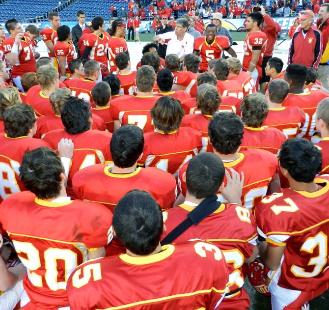 Cathedral Catholic huddles up around head coach Sean Doyle after winning its fifth straight Division III title