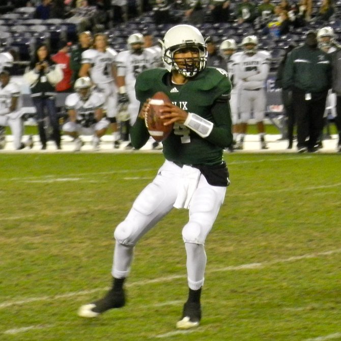 Helix quarterback Brandon Lewis looks for a receiver downfield