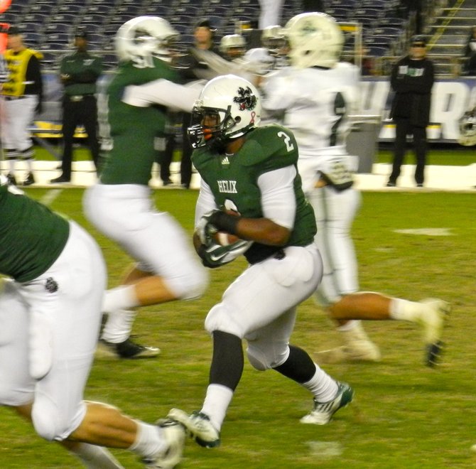 Helix running back Tyree Hunter carries the ball