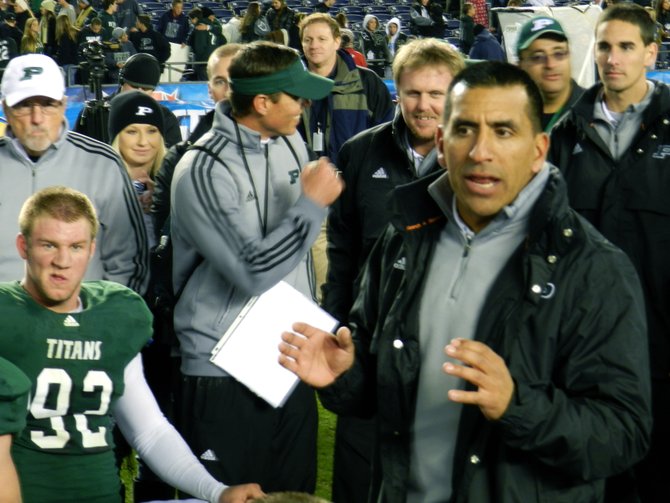 Poway head coach Damian Gonzalez addresses the Titans after beating Vista in the Division I finals