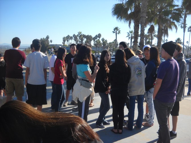 Group at Dog Beach gathers for Coastkeeper beach clean up.