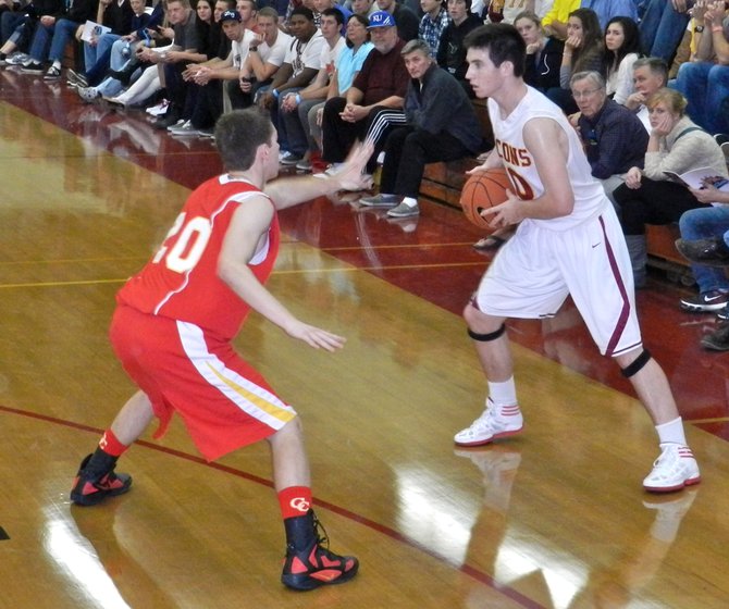 Torrey Pines guard Garrett Galvin guarded by Cathedral Catholic forward Nick Prunty at the three-point line