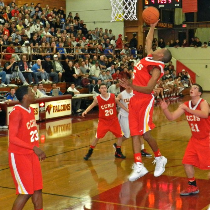 Cathedral Catholic guard Brandon Michel pulls down a rebound in the key
