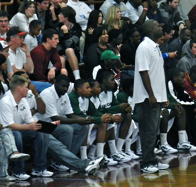 Lincoln head coach Jason Bryant and the Hornets bench